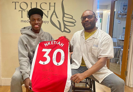 Footballer and Touch Tuina client Eddie Nketia poses with Errol Lynch at the Touch Tuina Kentish Town clinic