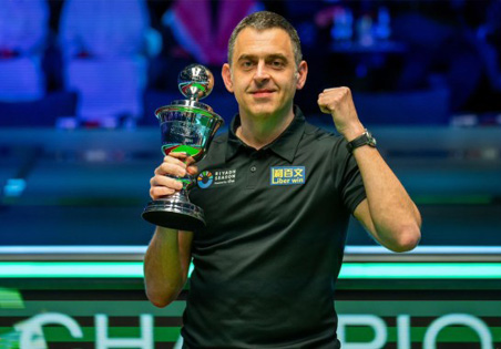 World Snooker Champion and Touch Tuina client Ronnie O'Sullivan poses with his winning trophy