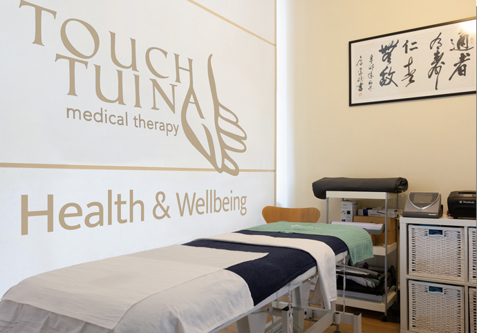 A picture of the inside of the Touch Tuina Kentish Town clinic featuring a treatment bed