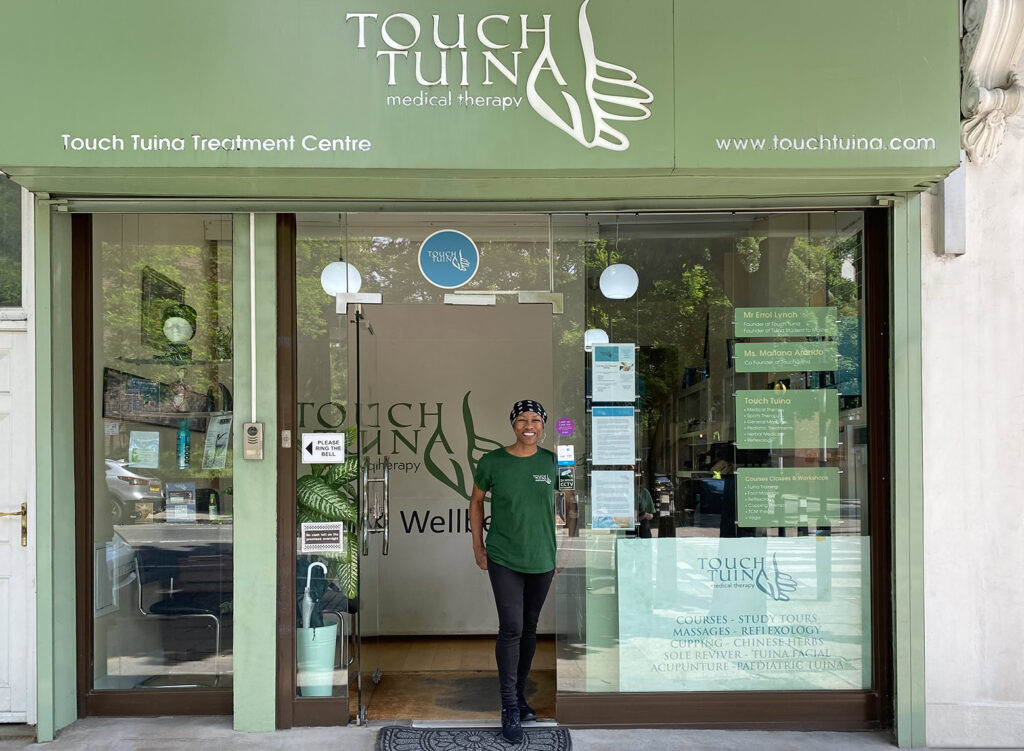 Touch Tuina Practitioner Dahl standing outside the Kentish Town clinic