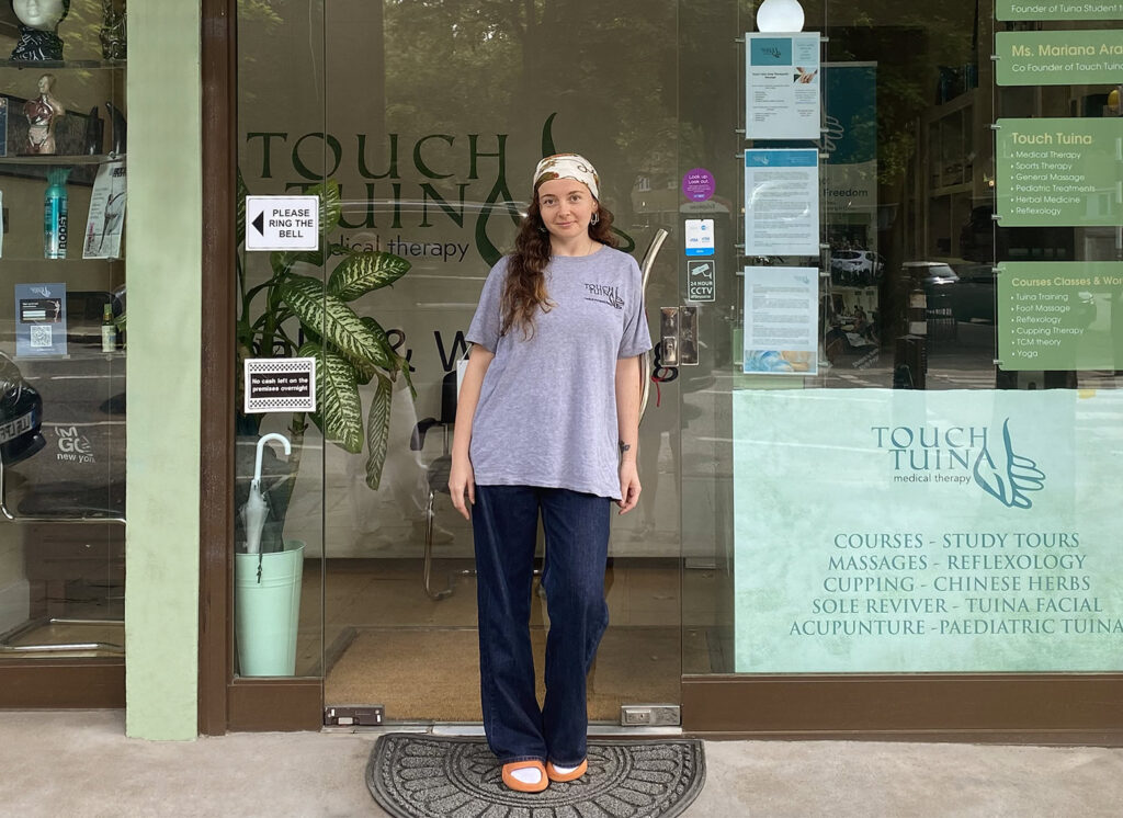 Touch Tuina Practitioner Hazel standing outside the Kentish Town clinic