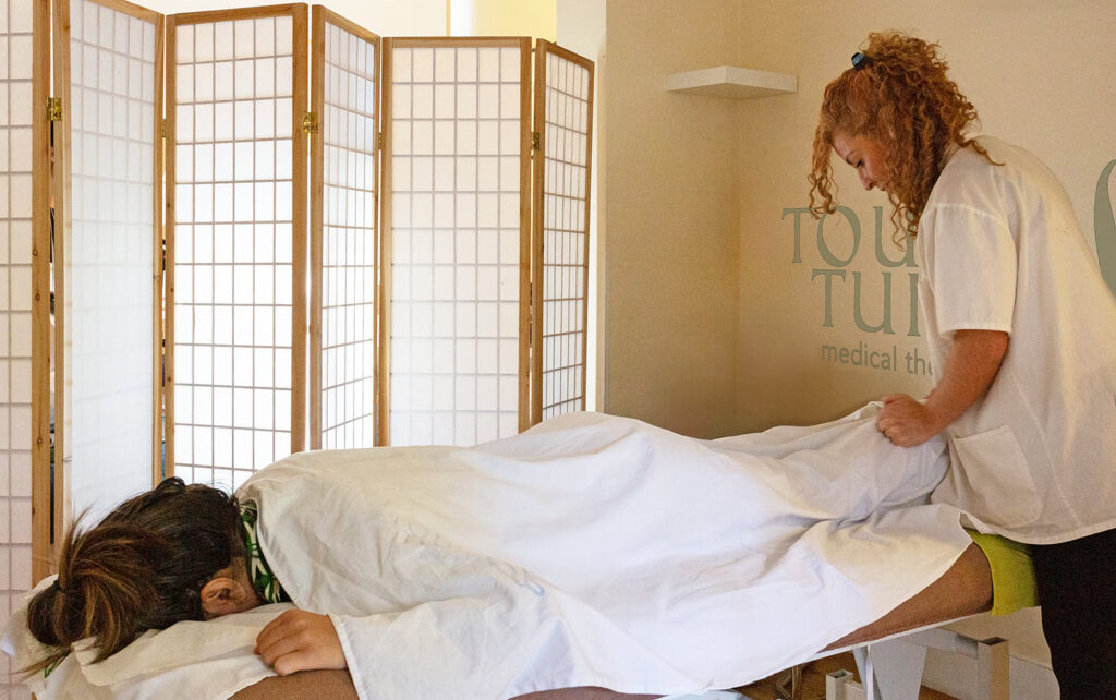 Mariana Arando demonstrates why Tuina Massage different from Deep Tissue Massage